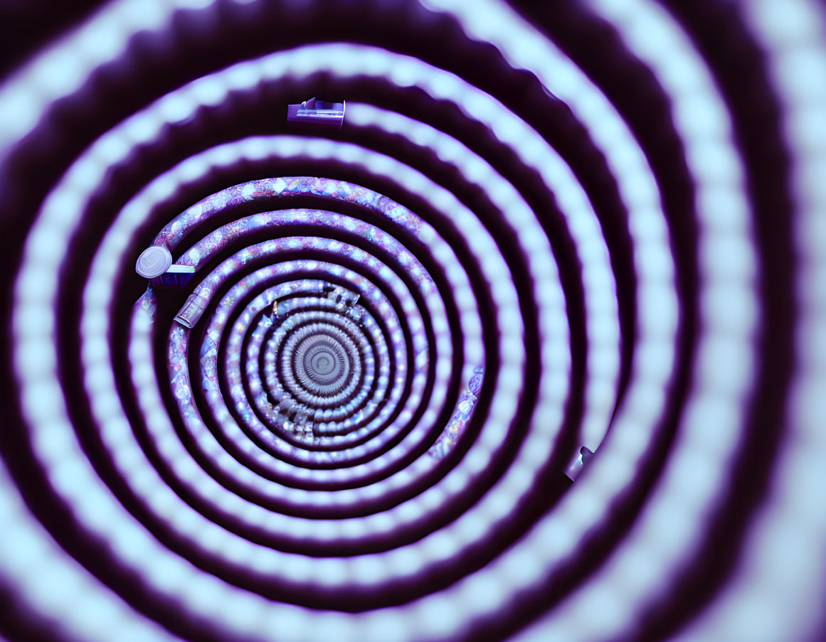 Surreal black and white spiral tunnel with mesmerizing pattern and diverse objects