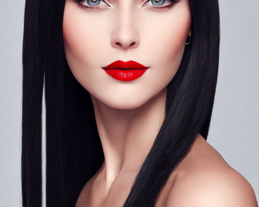 Portrait of Woman with Black Hair, Blue Eyes, and Red Lipstick on Gray Background