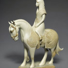 White Horse Sculpture with Golden Embellishments on Grey Background