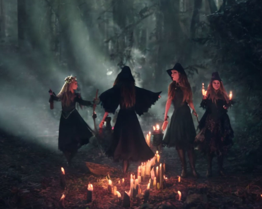 Four witches in mystical forest with candles and lanterns