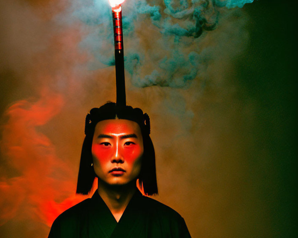 Traditional East Asian person with lit torch in dark attire on red backdrop