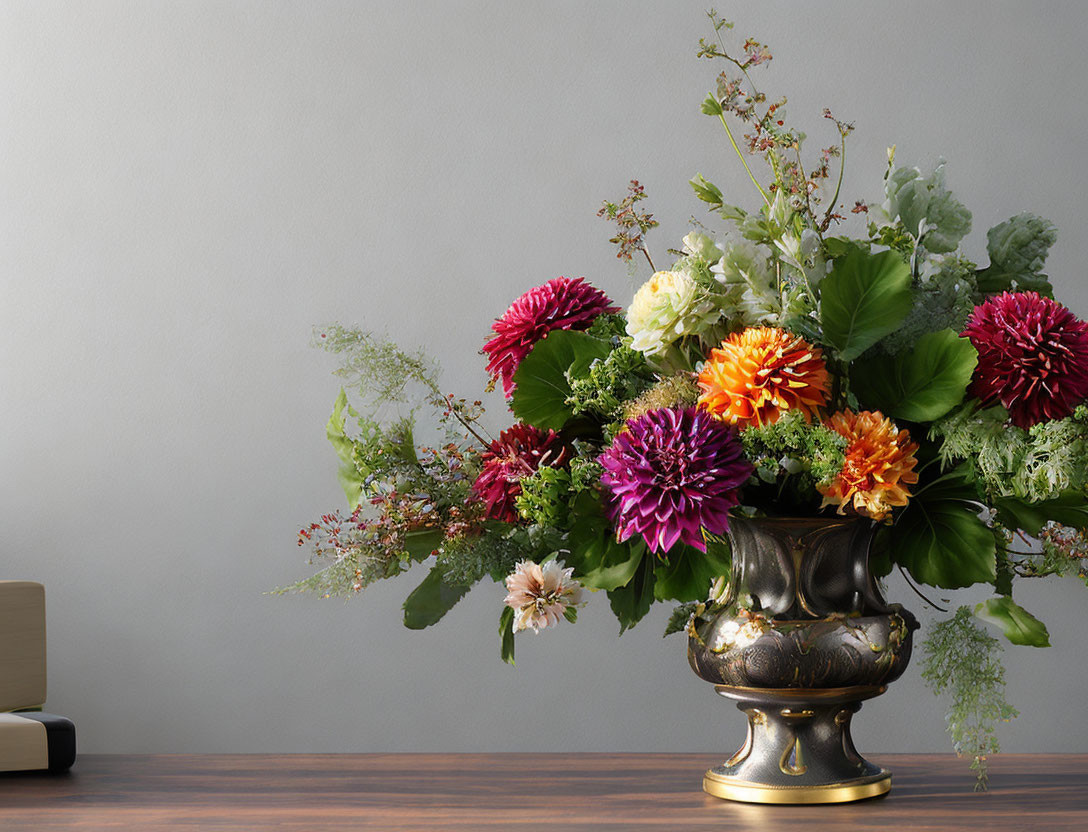 Colorful Mixed Flower Bouquet in Ornate Vase Against Gray Wall
