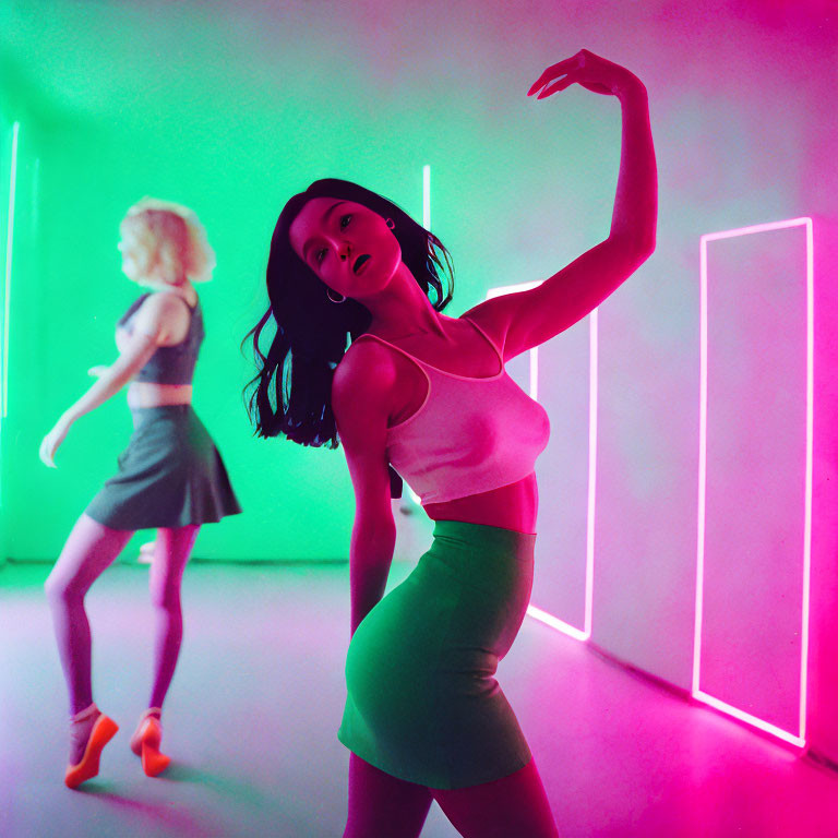 Vibrant neon-lit room with two women dancing