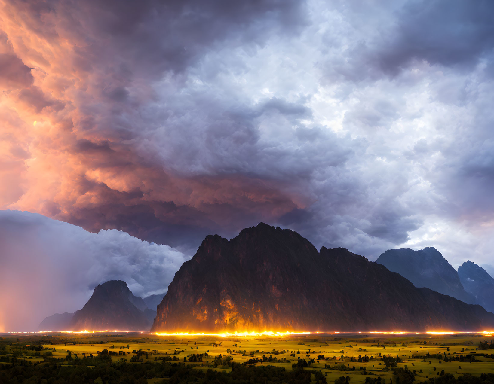 Dramatic landscape of wildfire near towering mountains at sunset