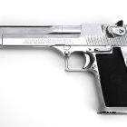 Silver and Black Semi-Automatic Pistol with Text and Symbols on White Background
