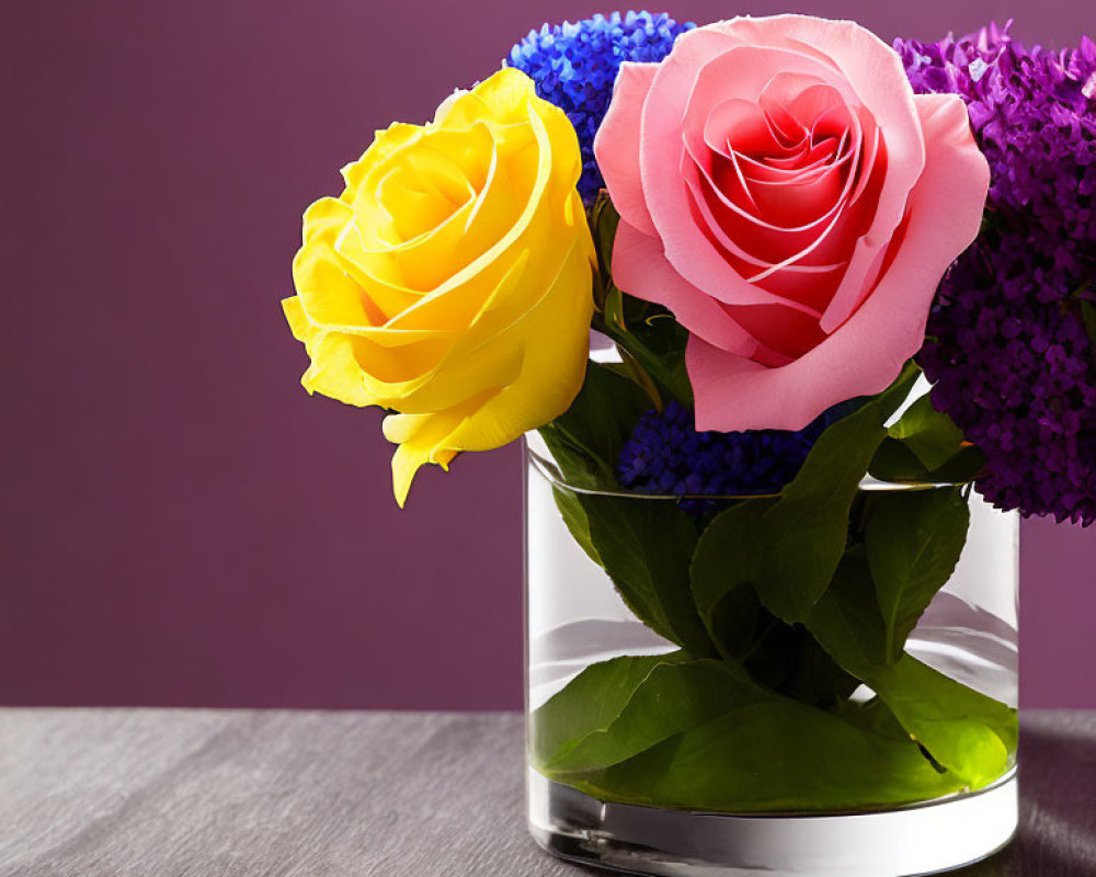 Colorful Rose Arrangement in Glass Vase with Purple Flowers and Green Leaves