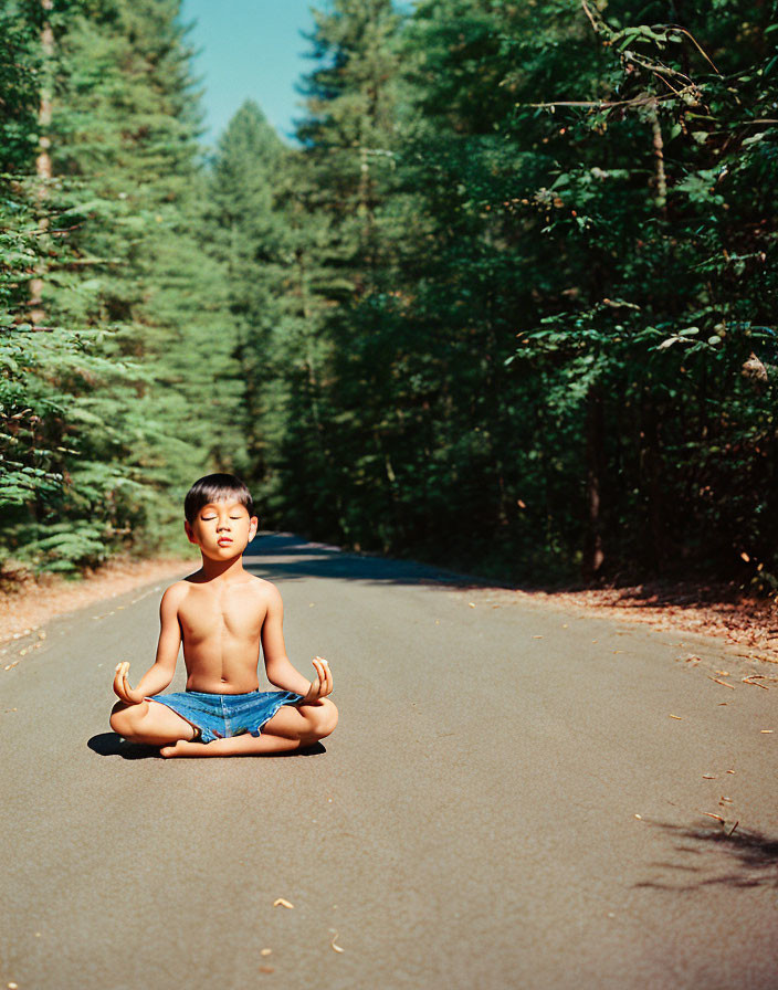 Child Meditating in Lotus Position Surrounded by Forest Trees