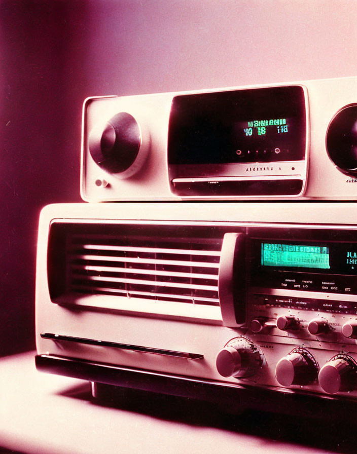 Stacked Vintage Radios with Digital Displays on Purple Background