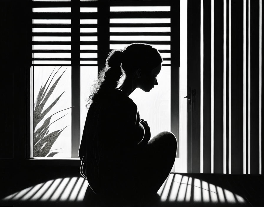 lonely sad women sitting in dark room by window 