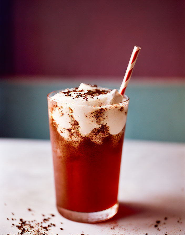 Whipped cream and chocolate shavings on frothy iced drink