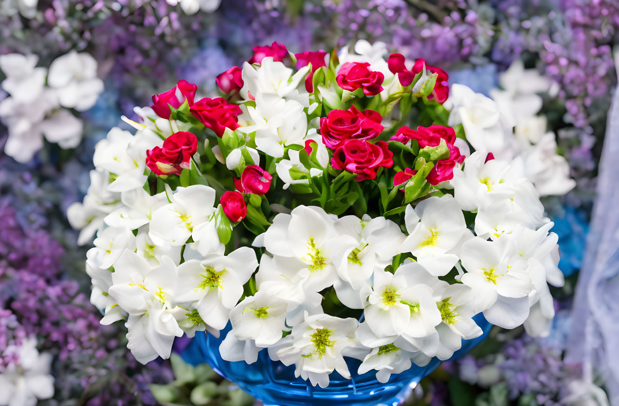 Red and White Flower Bouquet in Blue Vase on Purple Background