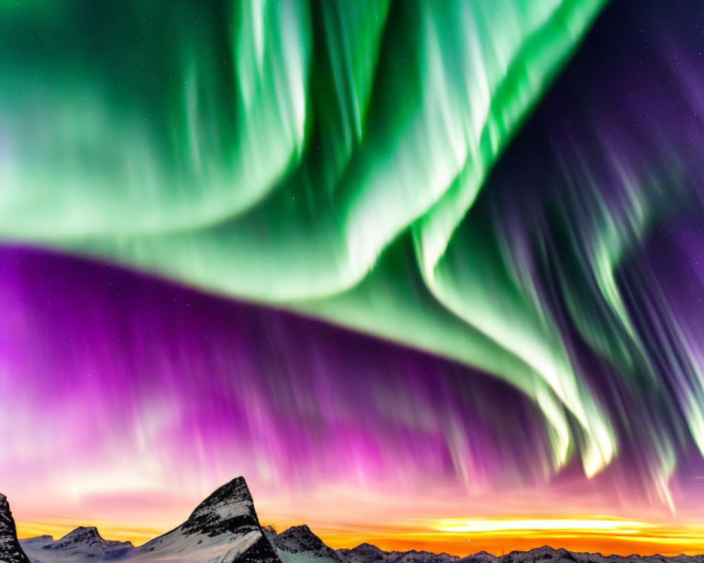 Colorful Aurora Borealis Over Snow-Capped Mountains at Twilight
