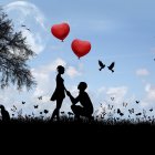 Silhouetted couple with heart-shaped balloons in field under blue sky