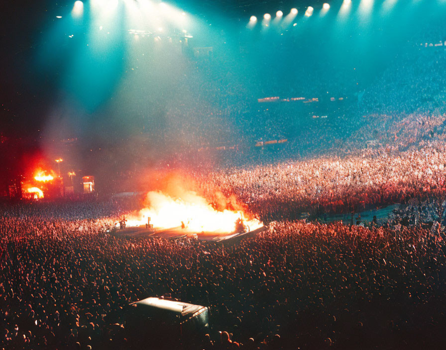 Crowd at Concert Lit by Stage Lights and Pyrotechnics