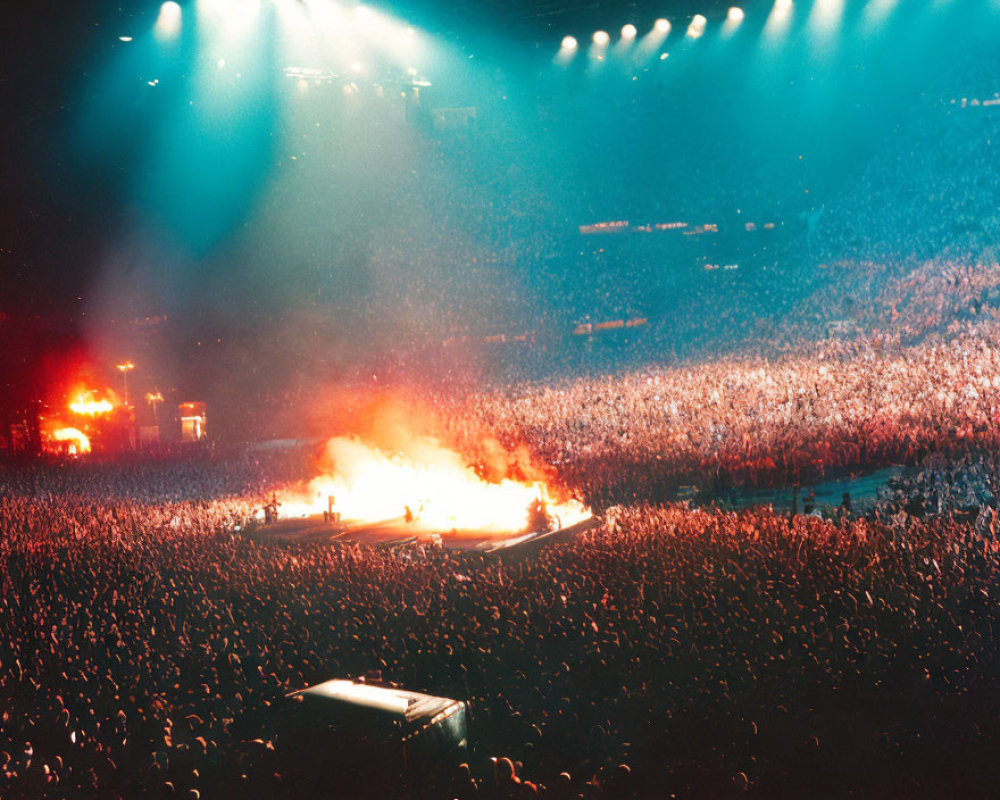Crowd at Concert Lit by Stage Lights and Pyrotechnics