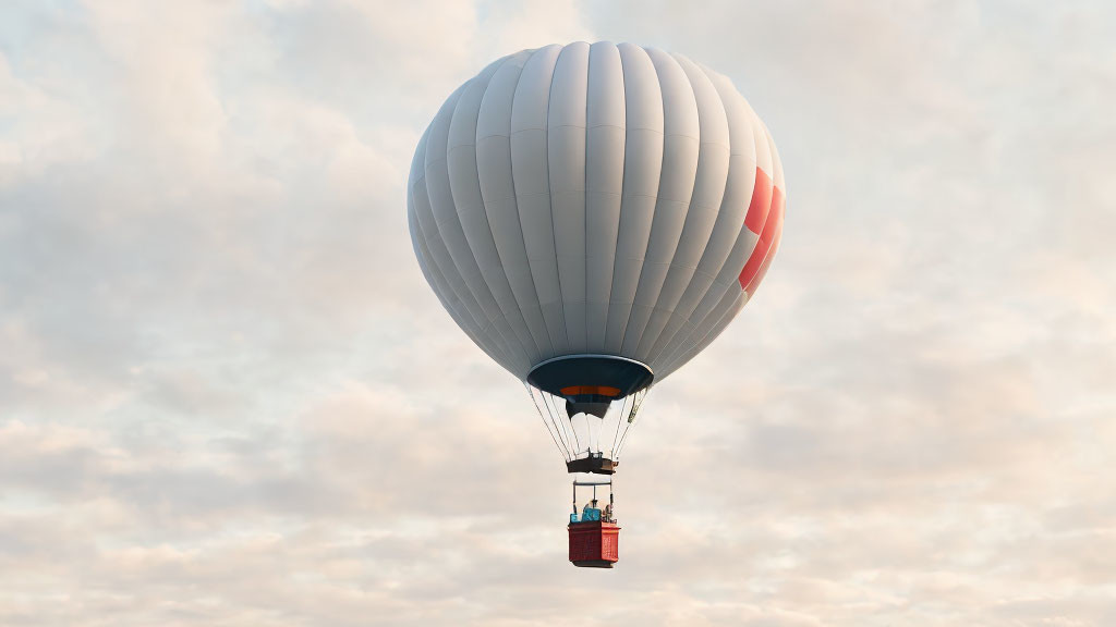 White and Red Hot Air Balloon Floating in Soft-Lit Sky