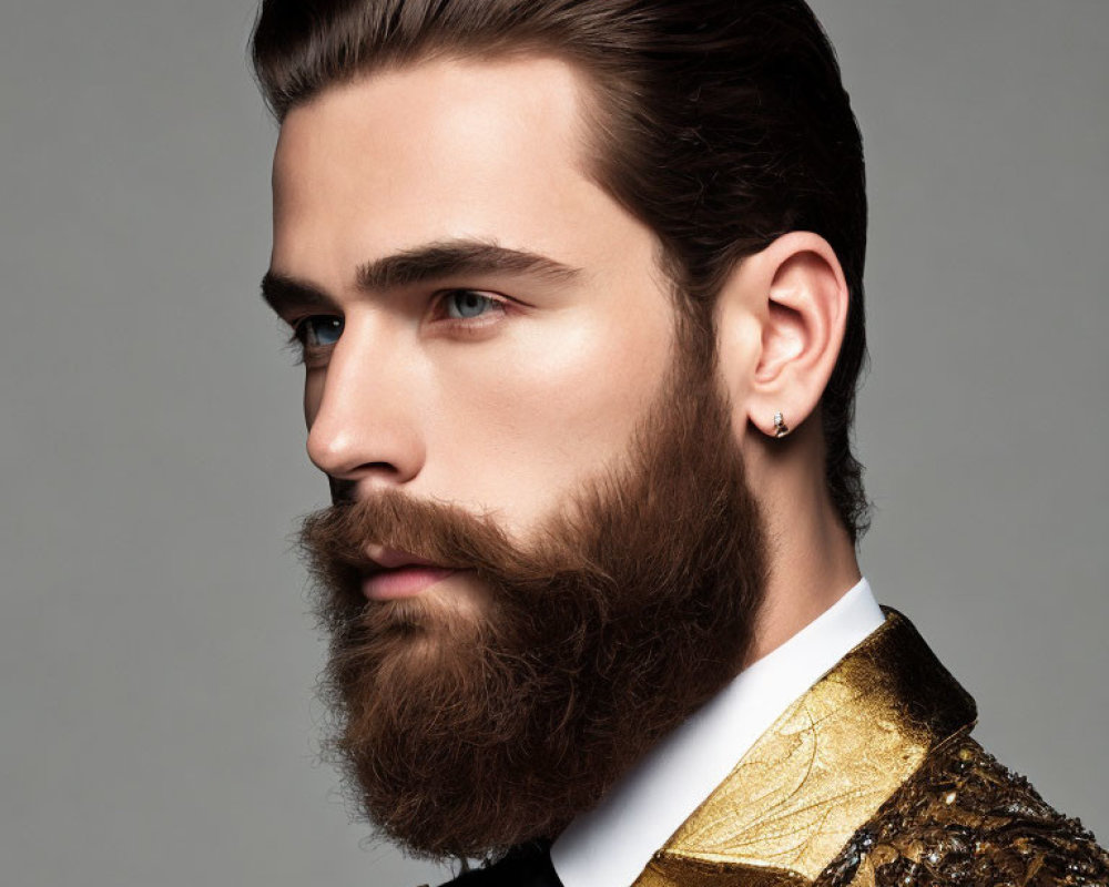 Stylish man with full beard in golden sequined jacket