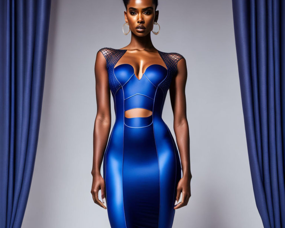 Striking blue bodycon dress with cut-outs and mesh detailing