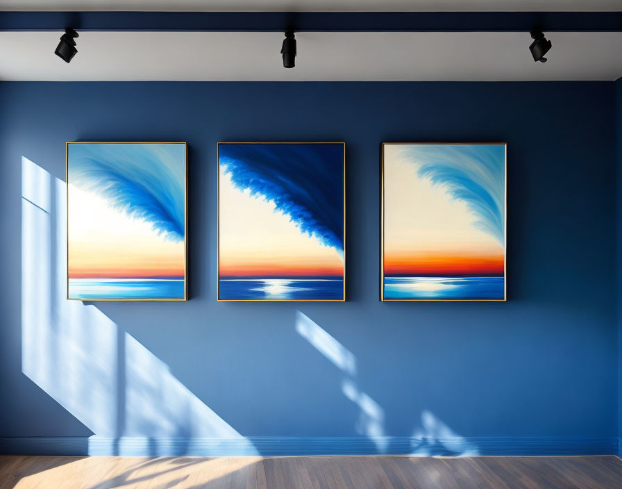 three paintings on a blue wall