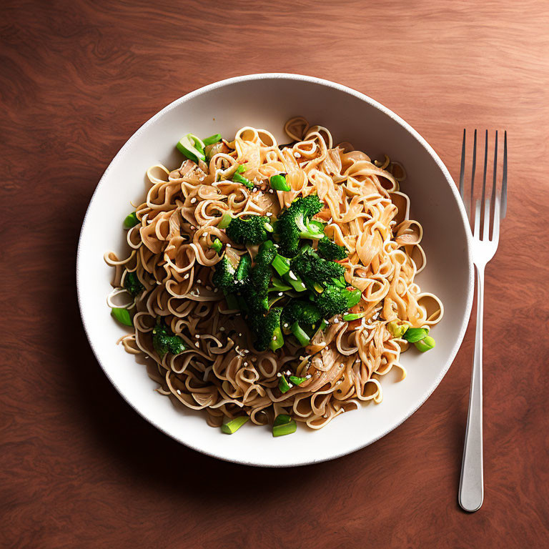 Stir-Fried Noodles with Broccoli and Green Onions on Wooden Table