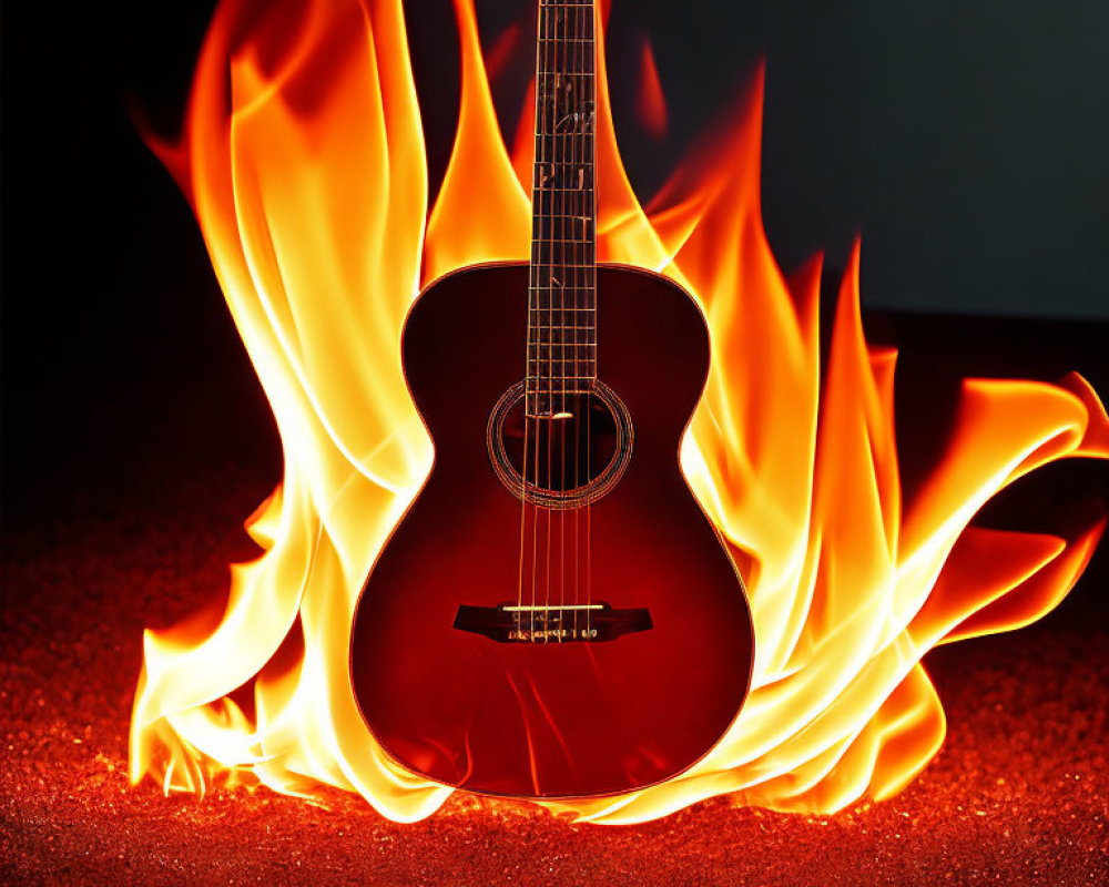 Flaming acoustic guitar on dark background