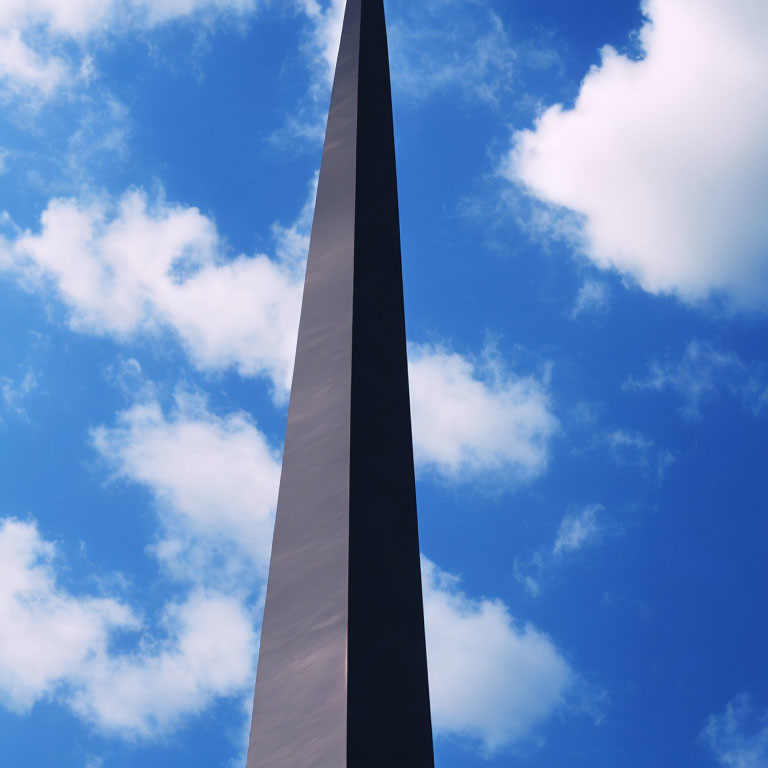 Tall slender monument under clear blue sky