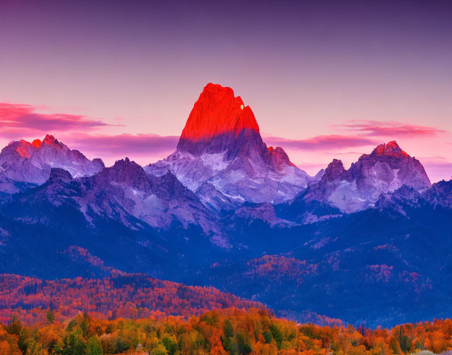 Majestic Mountain Peak in Warm Sunset Light above Autumn Forests