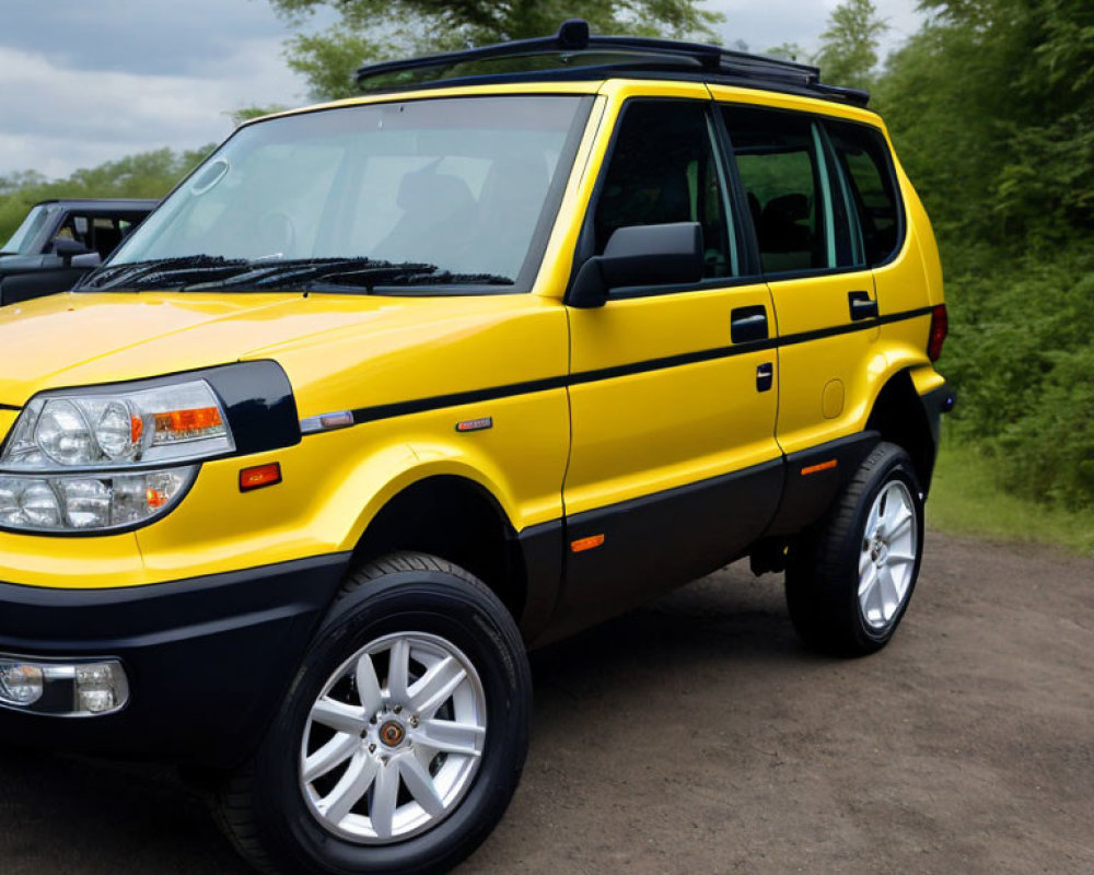 Yellow 4WD SUV with Chrome Wheels and Black Trim Outdoors