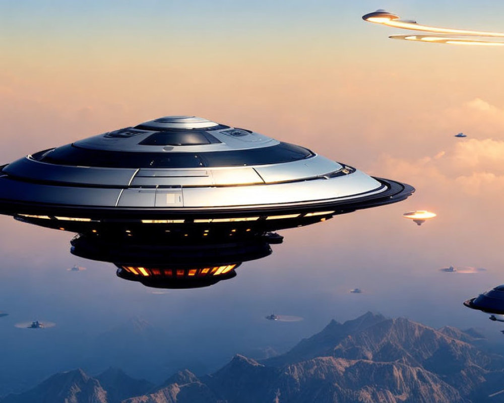 Futuristic flying saucers over sunset mountain peaks