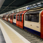 Modern Underground Station with Futuristic Orange Subway Train