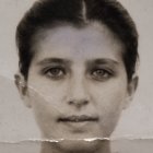 Monochrome portrait of woman's face with floral elements
