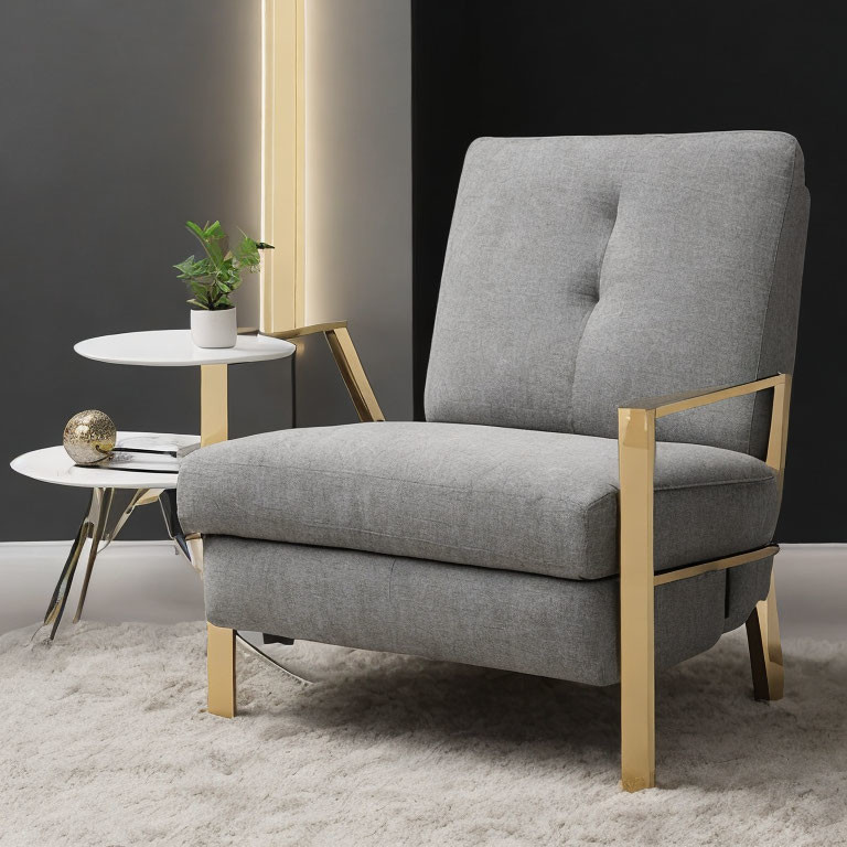 Modern Gray Armchair with Gold Accents Beside White Side Table on Dark Wall