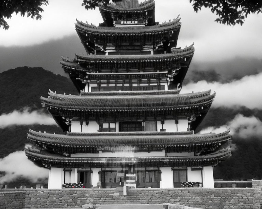 Traditional multi-storied pagoda against mountain backdrop