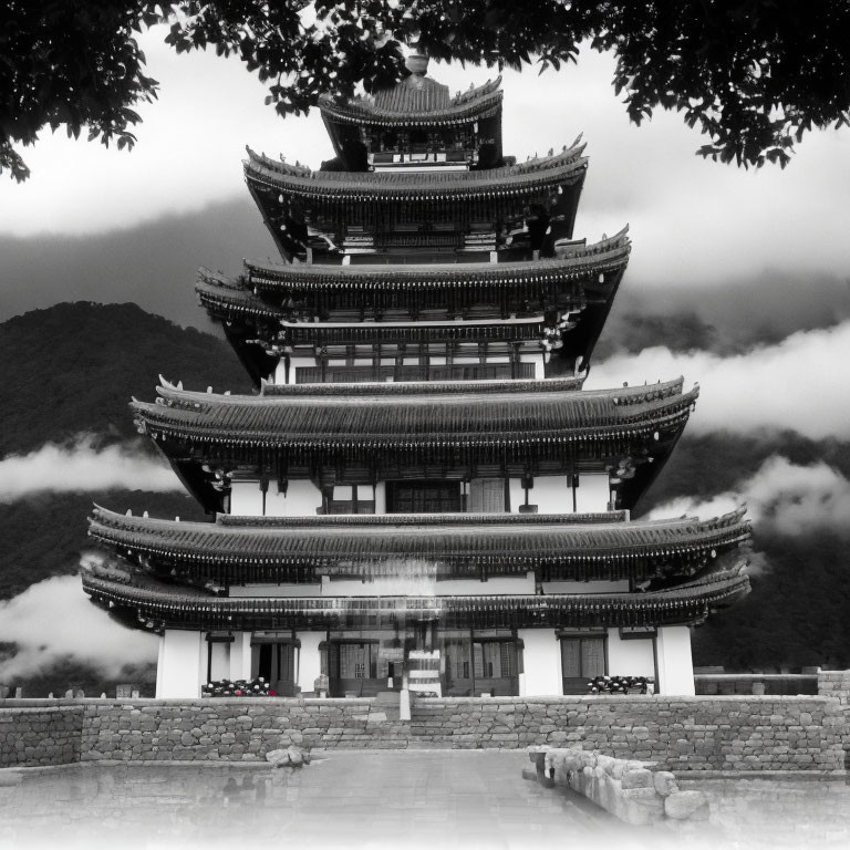 Traditional multi-storied pagoda against mountain backdrop