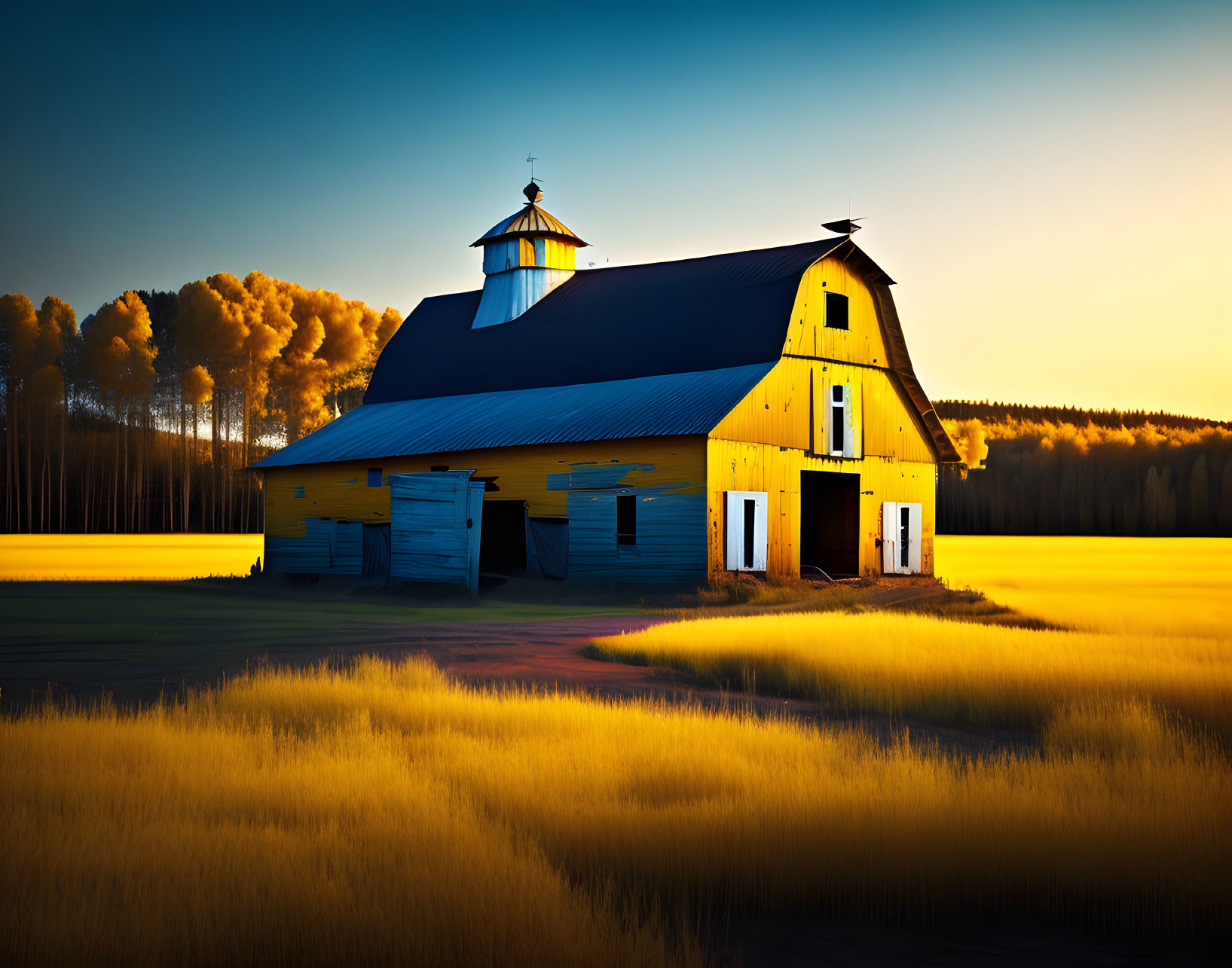 Yellow Barn in Golden Field with Trees and Sky at Dawn or Dusk