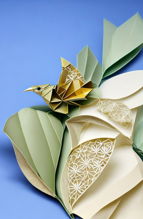 Detailed paper art sculpture featuring bird with patterned wings and leaves on blue background