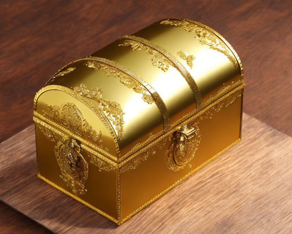 Golden ornate chest with floral patterns on wooden surface