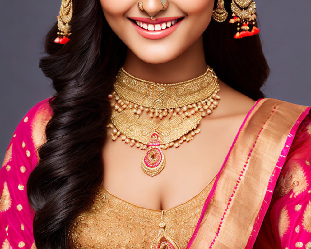 Traditional Indian Attire Woman in Pink Saree and Gold Jewelry