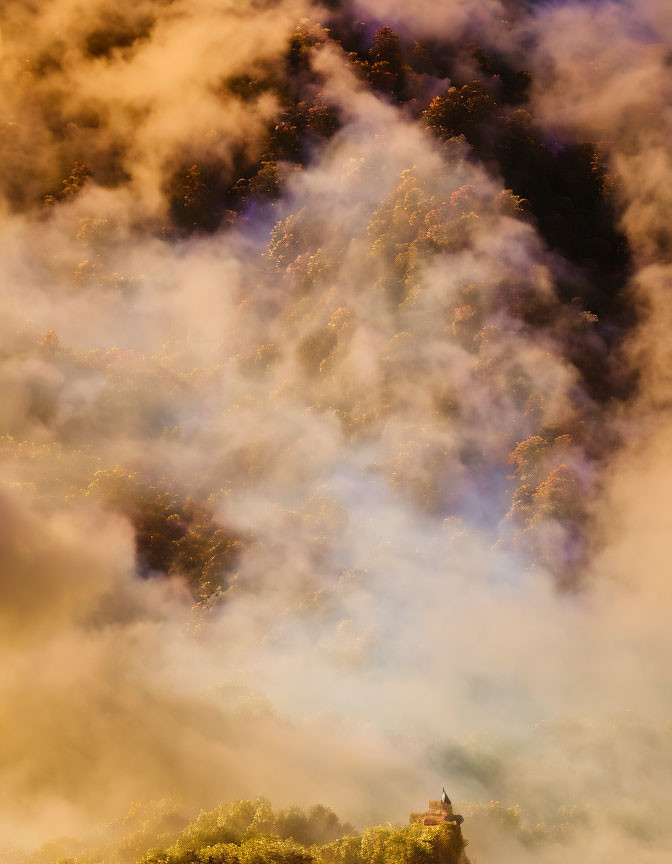 Misty hillside with golden sunlight and castle peeking through clouds