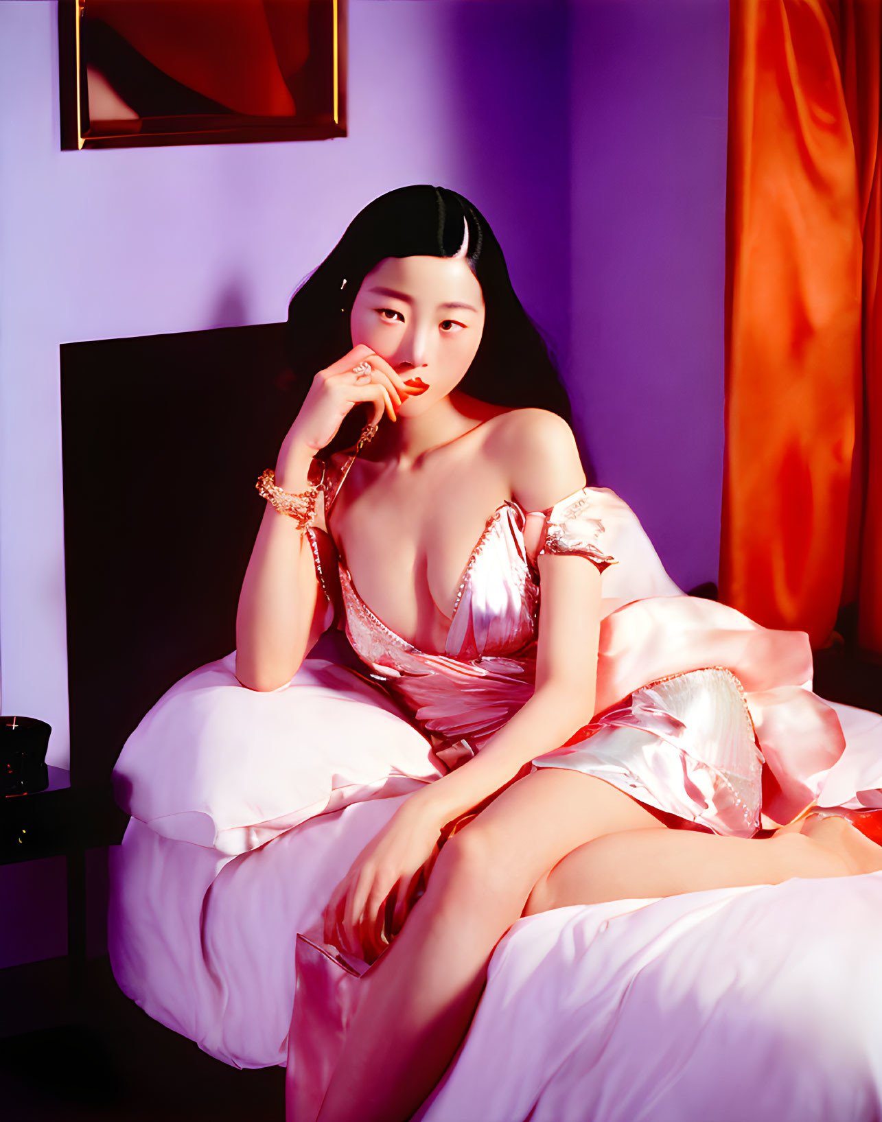 Woman in silk dress on pink bed with violet walls and orange drapes