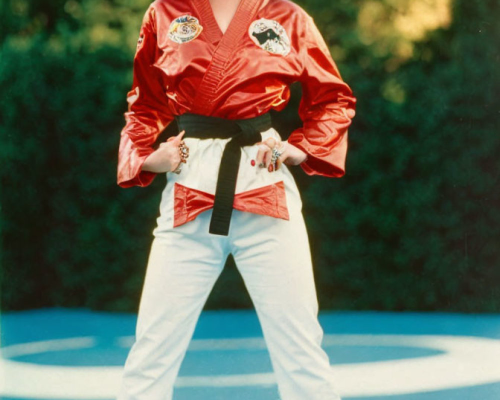 Confident Woman in Red Karate Gi on Martial Arts Mat