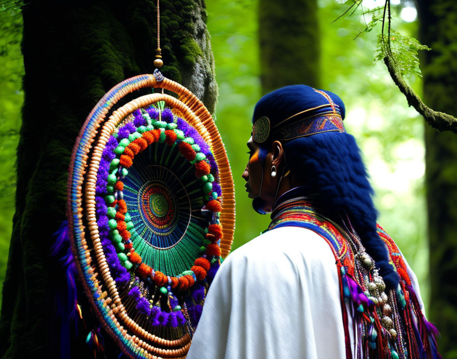 Person in Vibrant Traditional Attire by Colorful Dreamcatcher in Forest