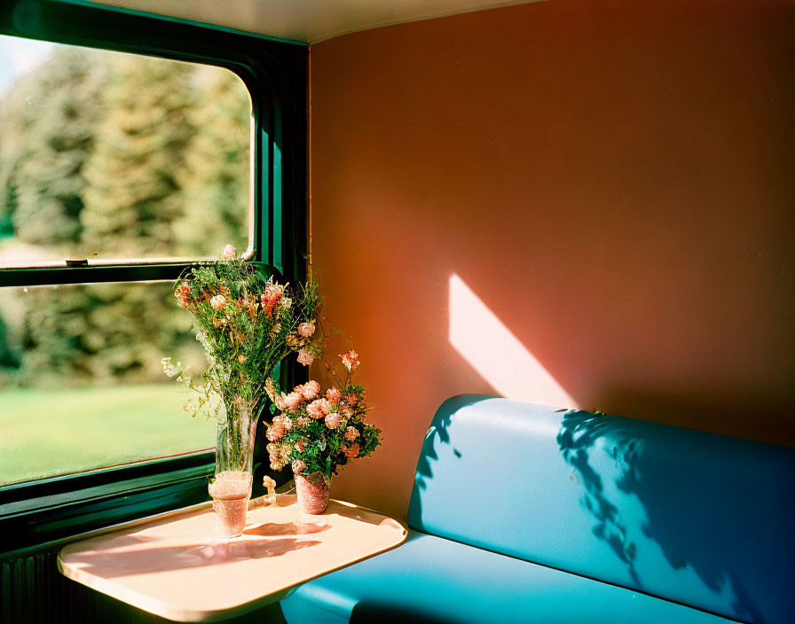 Sunlit Train Compartment with Bouquet of Flowers