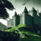 Medieval castle with spires on green hill under moody sky