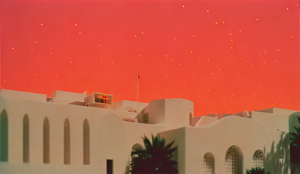 Curved white buildings under surreal red sky with stars