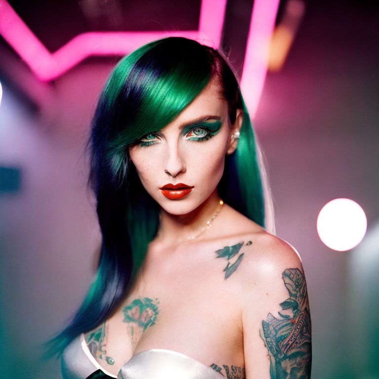Woman with Green and Black Hair and Shoulder Tattoos in Neon-lit Setting