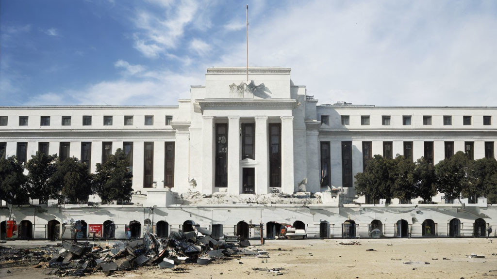 Damaged classical white building with scattered debris under blue sky
