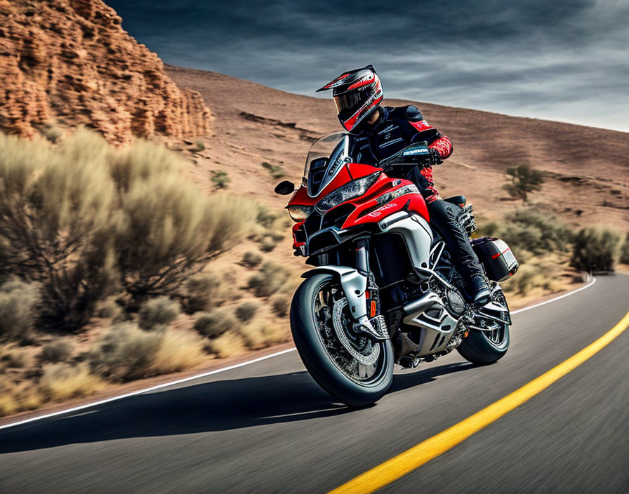 Motorcyclist in full protective suit riding red sport touring motorcycle on desert road