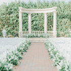 White Chair Wedding Ceremony Setup with Floral Arch & Backdrop