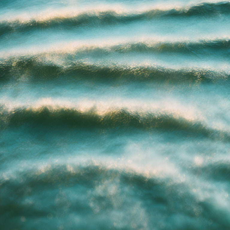 Tranquil ocean waves with sunlight reflecting on the water's surface